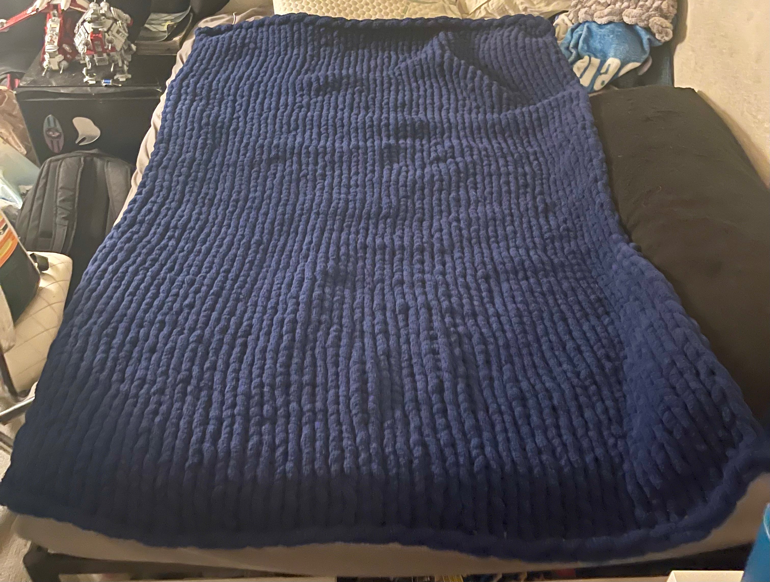 This is a twin with Navy as a knit stitch blanket.